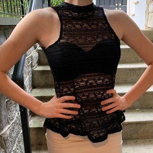 sheer mock neck top with a peplum shape